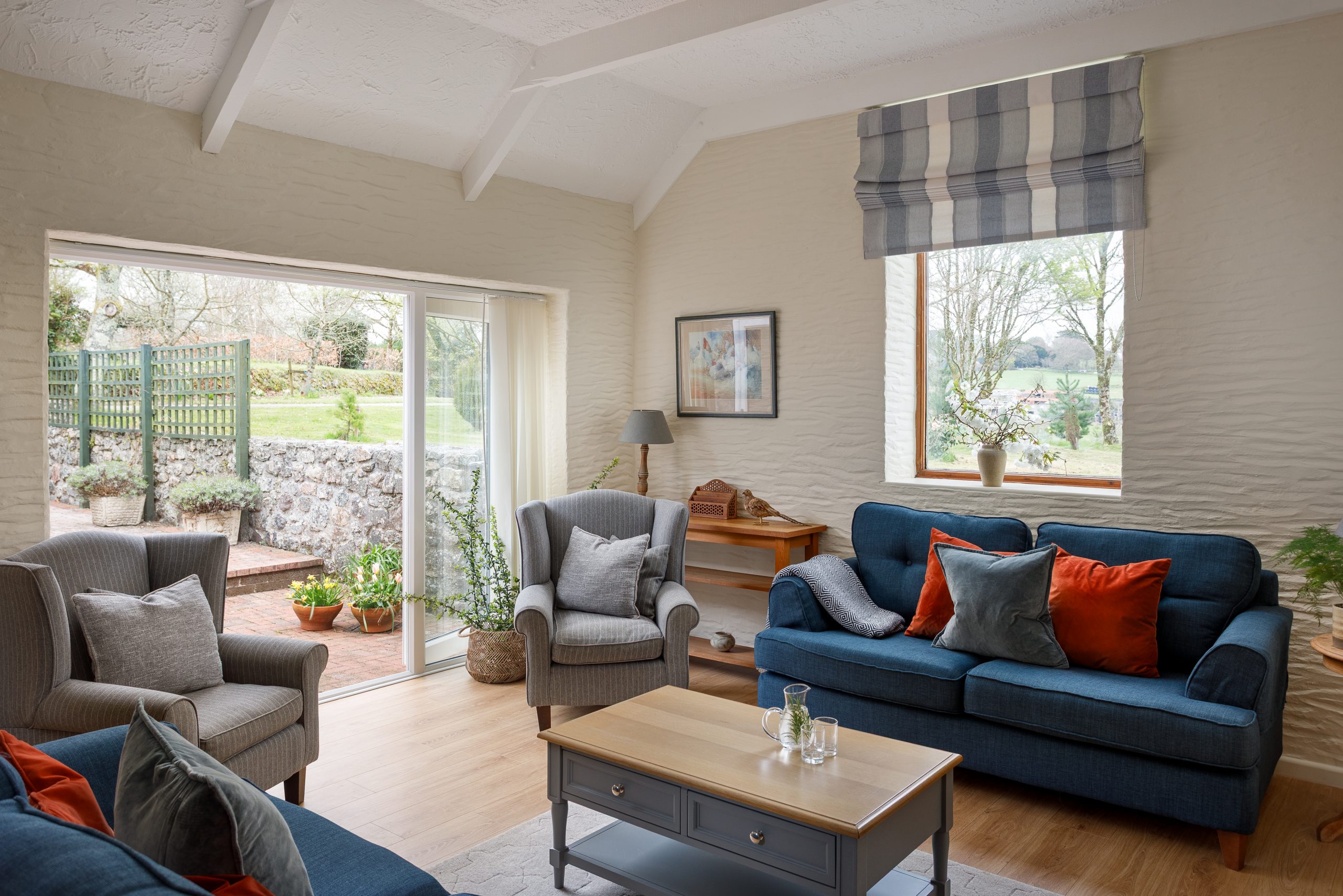 Stag Cottage sitting room, Double doors onto the enclosed terrace.